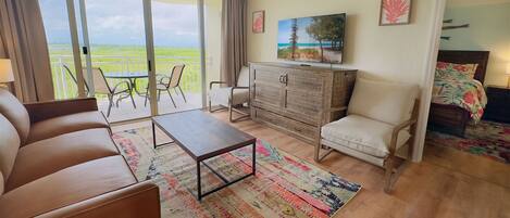 Living Room area with leather couch and flat screen TV