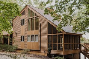 Unique cabin surrounded by trees on a wonderful Michigan inland lake. 