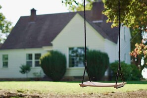 Unwind and enjoy a swing under the soothing shade of these beautiful old growth maple trees.