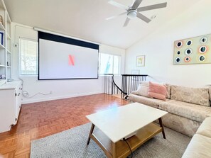 Lounge with your loved ones and enjoy a movie on the 110" screen.