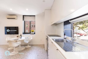 Kitchen window looks out to streetscape