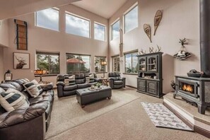 Cozy living room with a wood burning fireplace.