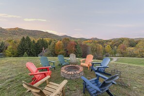 Experience the warmth and charm of a firepit alongside the perfect backdrop of mountain vistas.