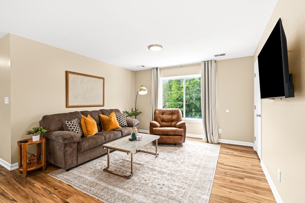 Relax in our inviting lounge space, furnished with cozy seating and a smart TV to elevate your entertainment experience.