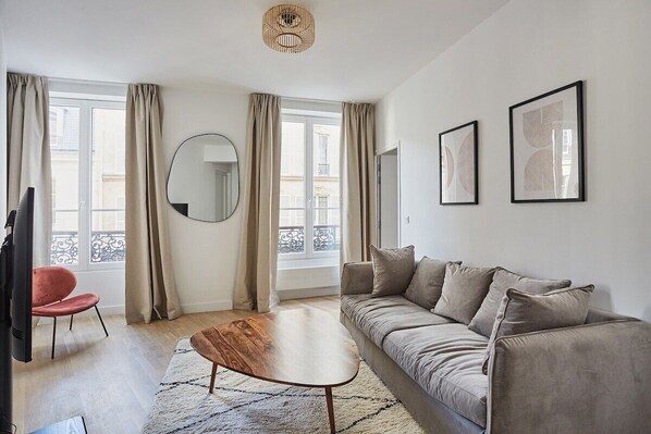 Salon avec canapé lit
