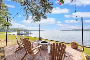 Firepit with a stunning lakeside view.