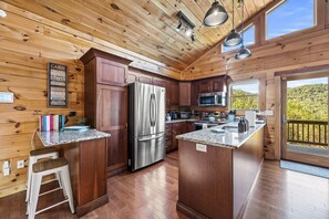 The fully-stocked kitchen has stainless steel appliances