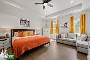 Bedroom with Bed and Couch: away from the stresses of the outside world.