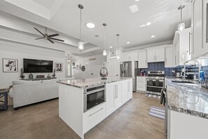 Caption:  A kitchen island with a view! This stunning kitchen island features a built-in aquarium, making it the perfect place to prepare meals and entertain guests.