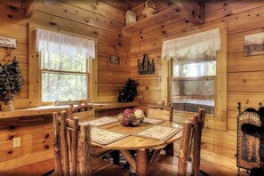 This maple-themed wooden cabin in Tennessee, is a perfect retreat in the Smoky Mountain area. Stay cozy by the stacked-stone fireplace and unwind on a full leather couch that complements the warm color scheme. Enjoy the beauty of the Smoky Mountain scenery!
