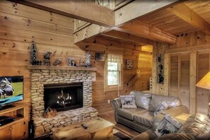 Enjoy a cozy stay in this pet-friendly Sevierville cabin, a romantic retreat with a mountain view. This Sevierville vacation rental, near Pigeon Forge, offers comfort and elegance, perfect for relaxing on chilly nights while surrounded by Smoky Mountain scenery.