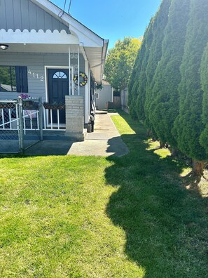 Front and side yard, fully fenced.