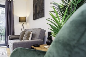 Comfortable living room with a sofa bed, offering a cozy space to relax or extra sleeping arrangements.