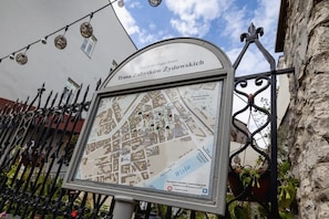 An outdoor map display near the apartment, providing guidance for exploring the area.
