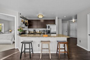 Fully Stocked Kitchen and Breakfast Bar (Seating for Three (3))