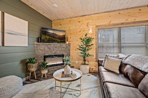Elegant Living Room: A perfect spot to relax, reflecting the charm of mountain life. Local Fact: The Smoky Mountain area has over 90 historic structures including homes, barns, and churches.