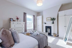 Bedroom 1 boasts a comfortable king-size bed and plenty of storage.