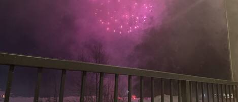 Watching fireworks from the hot tub with a glass of wine!