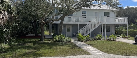 Home with 2 parking spaces on gravel and 2 spaces in driveway.