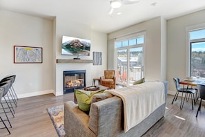 Living Area With Gas Fireplace and Patio Access