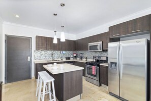 Elegance meets functionality in our beautifully designed modern kitchen and dining area.