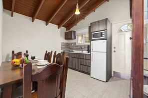 Well-equipped kitchen with dining table.