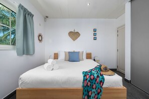This bedroom has queen sized bed and its own AC. Perfect for a delightful stay!