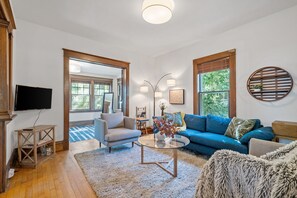 Televisions in the living room, kitchen annex, and on the 3rd story. 