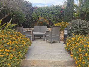 Back garden with comfortable outdoor seating 