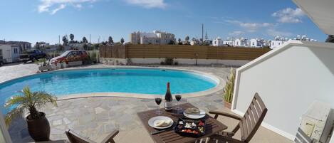 Sunny private terrace overlooking pool