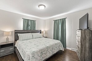 Main level bedroom, king bed, dresser, closet, 2 night stands