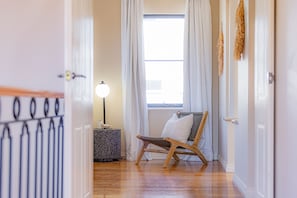 Relax and unwind in this inviting sitting area, featuring comfortable seating and a cozy atmosphere.
