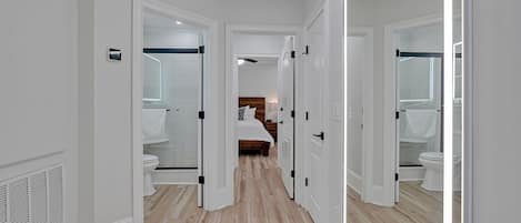 Hallway with a view of the guest bathroom and master bedroom.