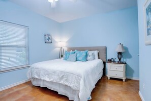 Master bedroom with a king-size bed and plush, comfy pillows. (1)