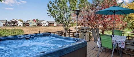 6 person hot tub, 6 person patio table, and grill.