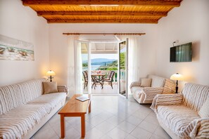 Dining and living area with charming views