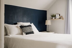 Discover comfort in the cozy bedroom with a queen-sized bed. 