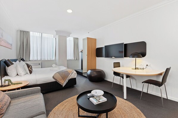 Relax in this roomy studio with a lovely sitting area and a comfortable bed.