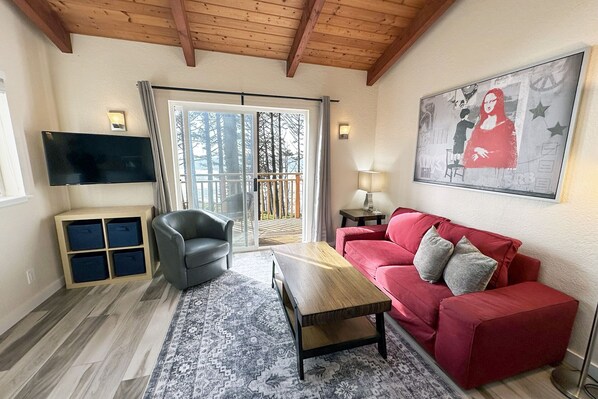 Bright and airy living room with view from the south side duplex.