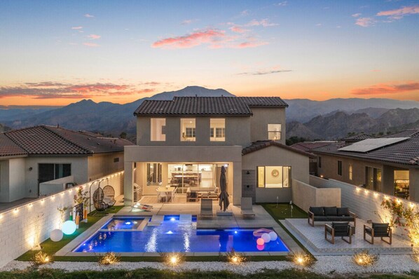 A breathtaking evening view of the luxurious poolside villa