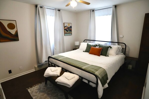 Master Bedroom - King size bed with closet storage and dresser. TV in room as well. 