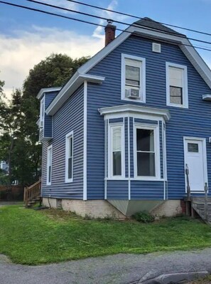 Exterior of home. Off street parking/driveway to the left. 