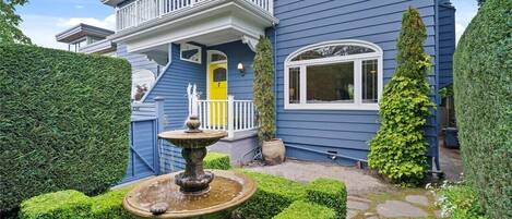 Yellow door is the main entrance. Beautiful fountain welcomes you.
