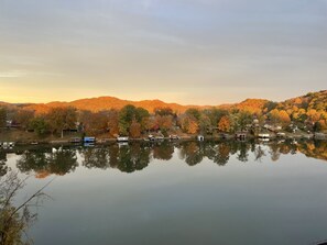 Fall colors on the lake at sunset