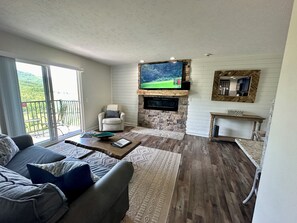 living area with smart tv and electric fireplace 