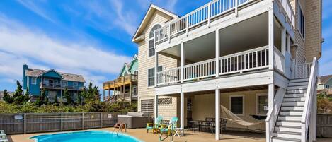 Back exterior with private pool