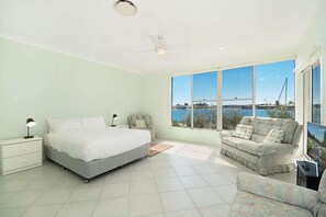 Main bedroom with water views, direct access to pa