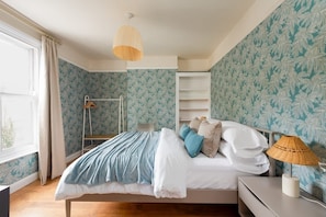 The walls are adorned in a soft, pastel blue hue, evoking a sense of tranquility and serenity