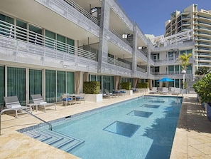 Dive into Relaxation at Our Communal Pool, a Shared Space for Residents to Enjoy.