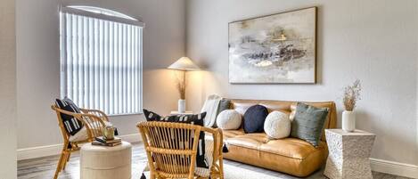 Modern elegance meets cozy comfort in this sunlit living space